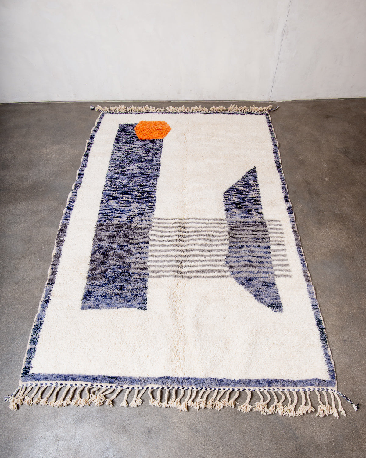 Modern, designer, handcrafted Berber rug from Morocco. Beniourain carpet with beautiful colours and patterns and fluffy wool texture.
